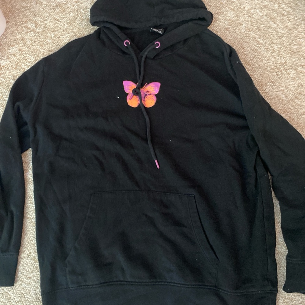 black hoodie with design on from and back